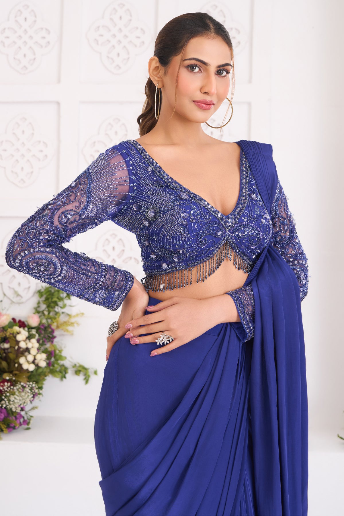 Indigo Blue Crepe Silk Pre-Draped Saree featuring Heavily Hand-Embellished V-Neck Full Sleeve Blouse