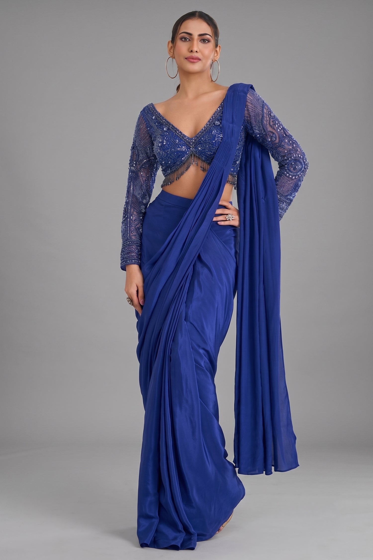 Indigo Blue Crepe Silk Pre-Draped Saree featuring Heavily Hand-Embellished V-Neck Full Sleeve Blouse Main image