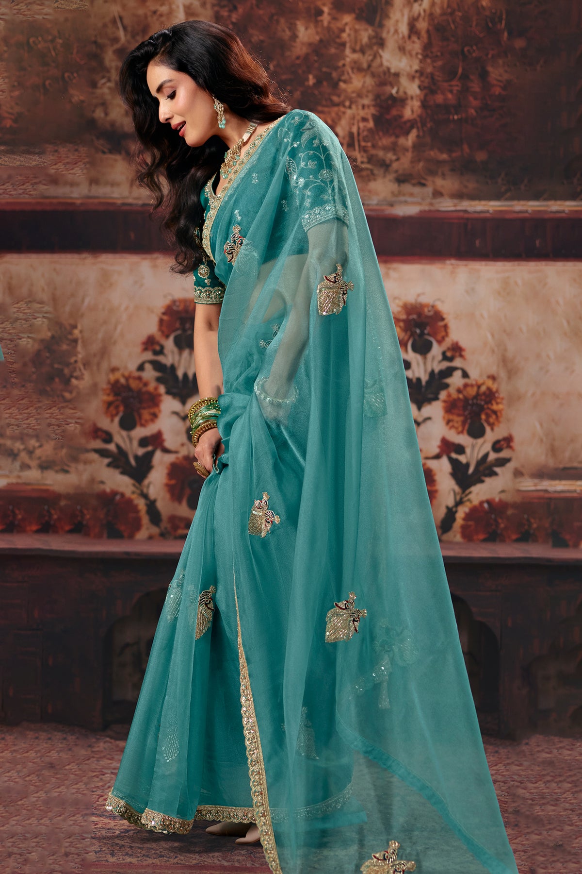 Sea Green Organza Saree with Intricate Border Work