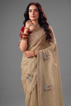 Muted Cream Organza Saree with Subtle Embroidered Buttashork