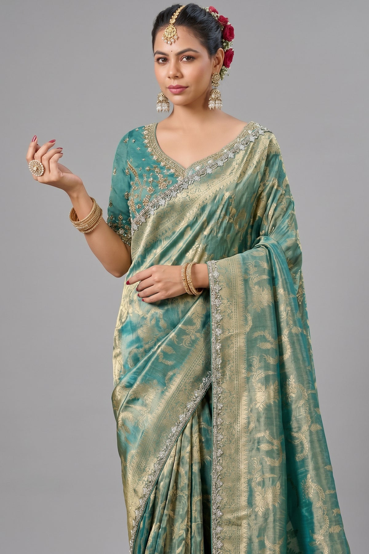 Deep Teal Metallic Tissue Saree detailed with Intricate Weaving