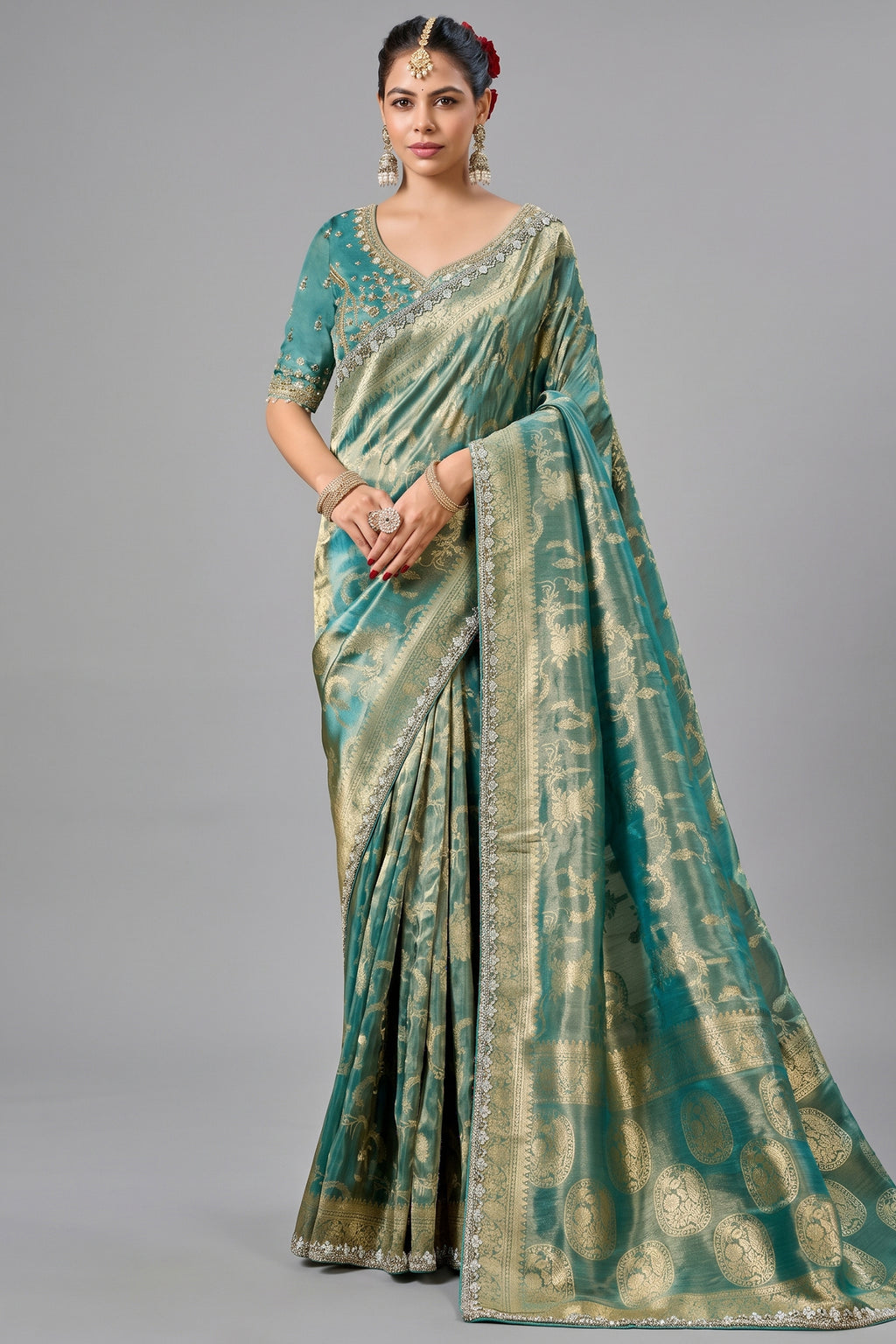 Deep Teal Metallic Tissue Saree detailed with Intricate Weaving