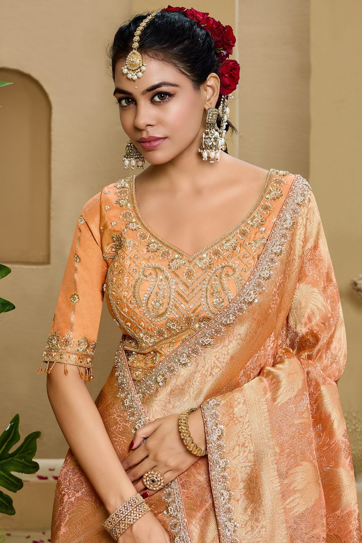 Warm Peach Metallic Tissue Saree detailed with Intricate Weaving