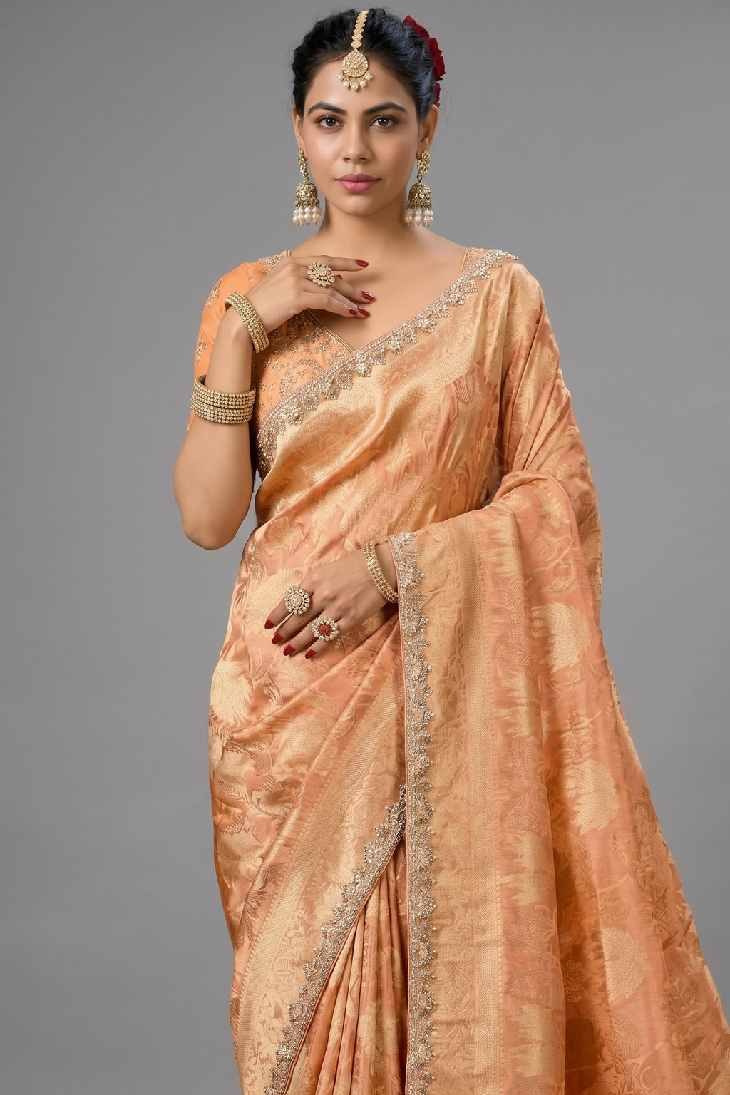 Warm Peach Metallic Tissue Saree detailed with Intricate Weaving