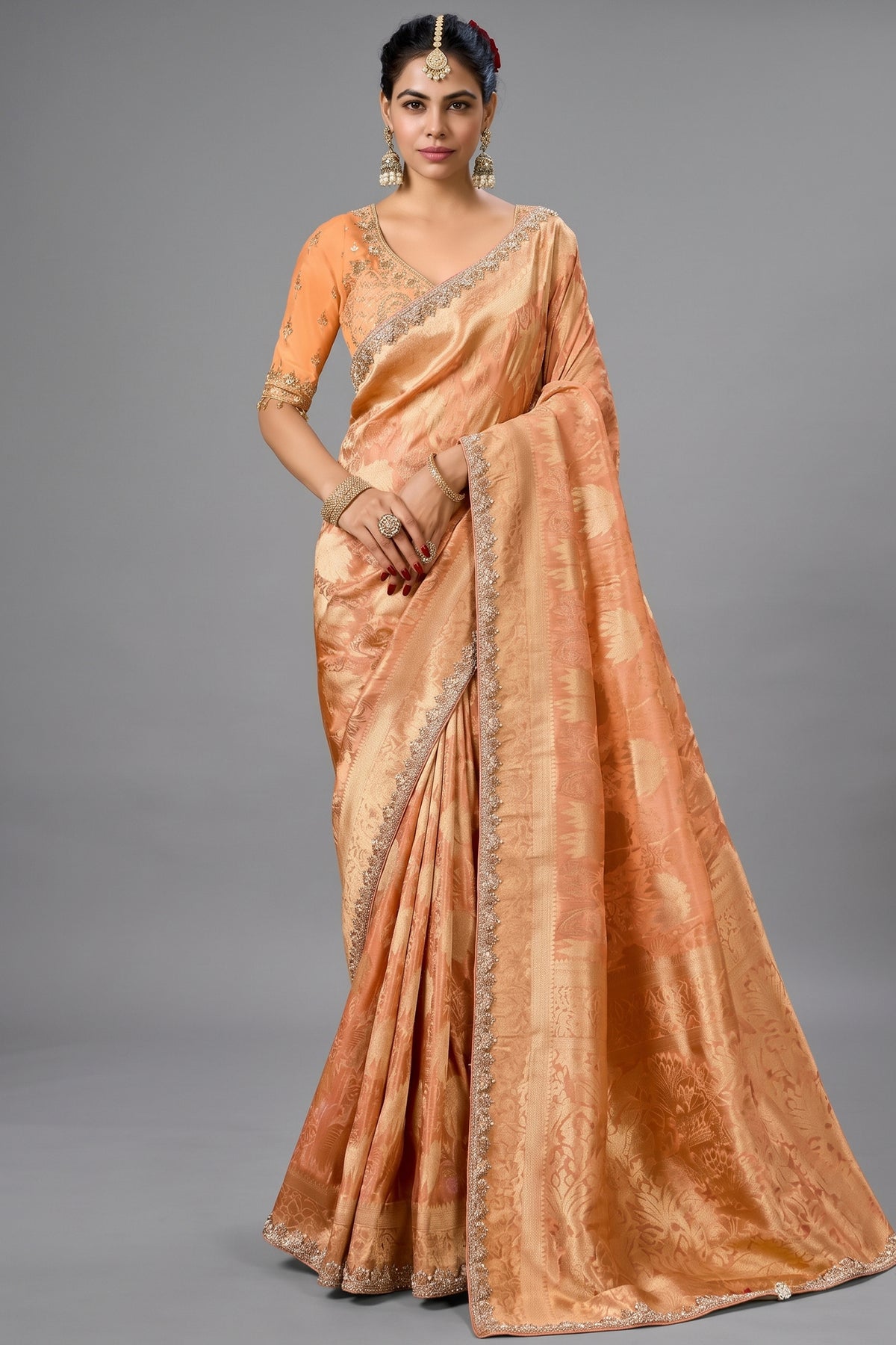 Warm Peach Metallic Tissue Saree detailed with Intricate Weaving