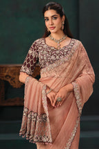Peach Crush Tissue Saree highlighted with Shimmering Sequins and Pearls