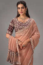 Peach Crush Tissue Saree highlighted with Shimmering Sequins and Pearls