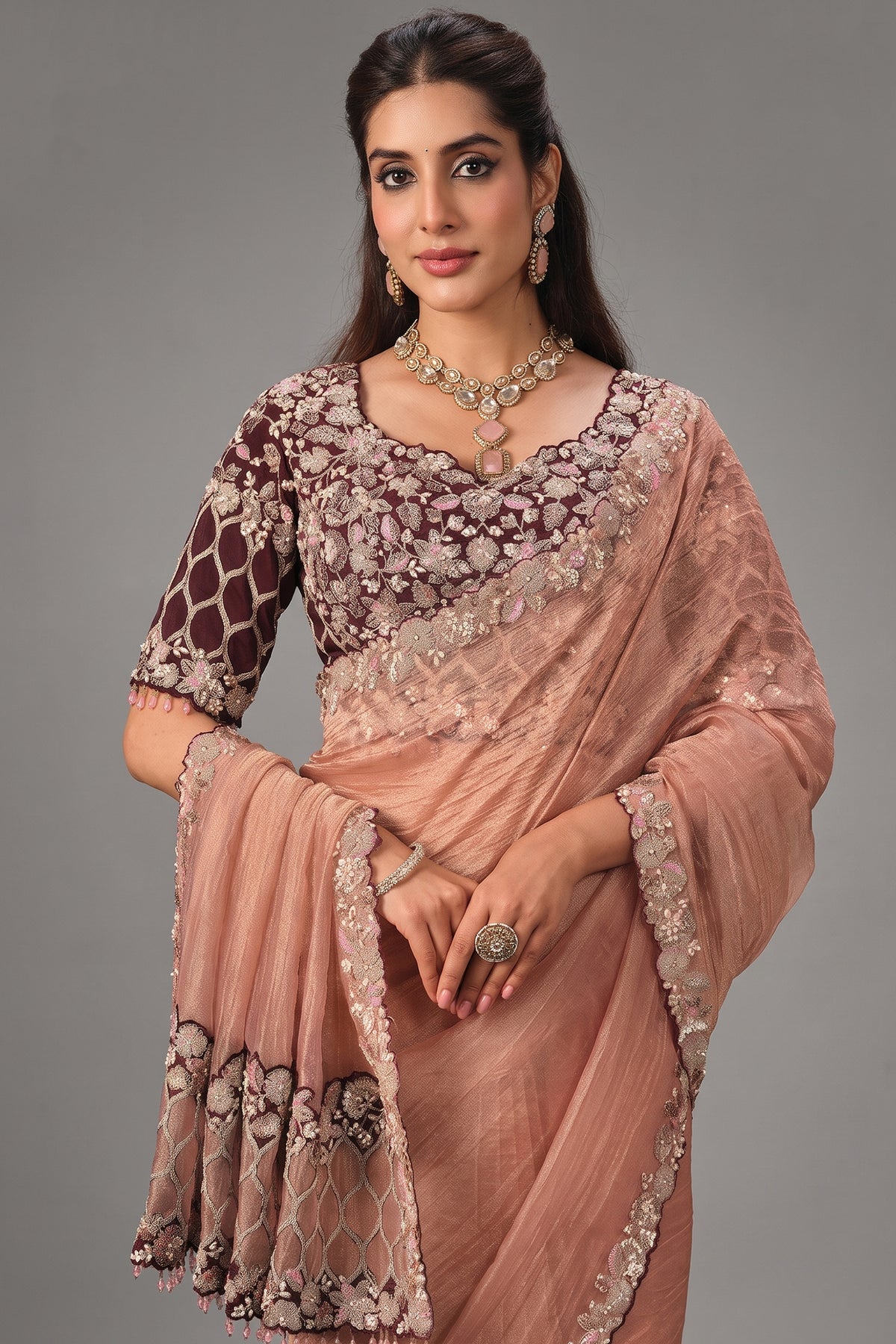 Peach Crush Tissue Saree highlighted with Shimmering Sequins and Pearls