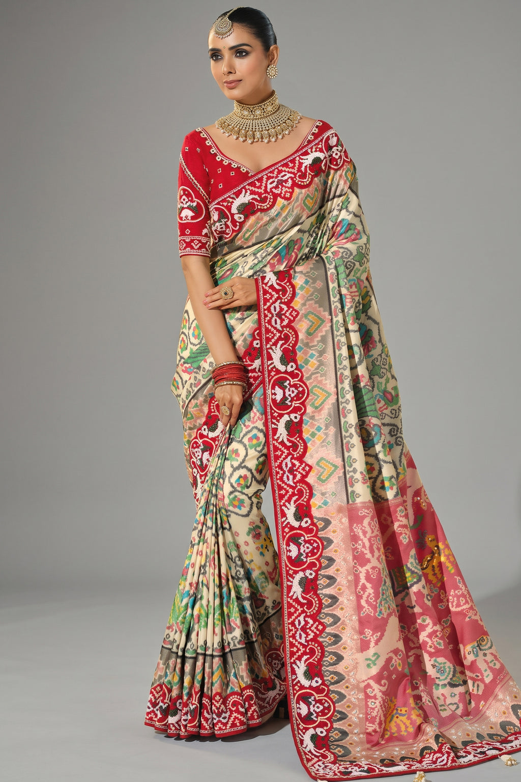 Cream Silk Traditional Patola Saree with Contrast Beaded Border