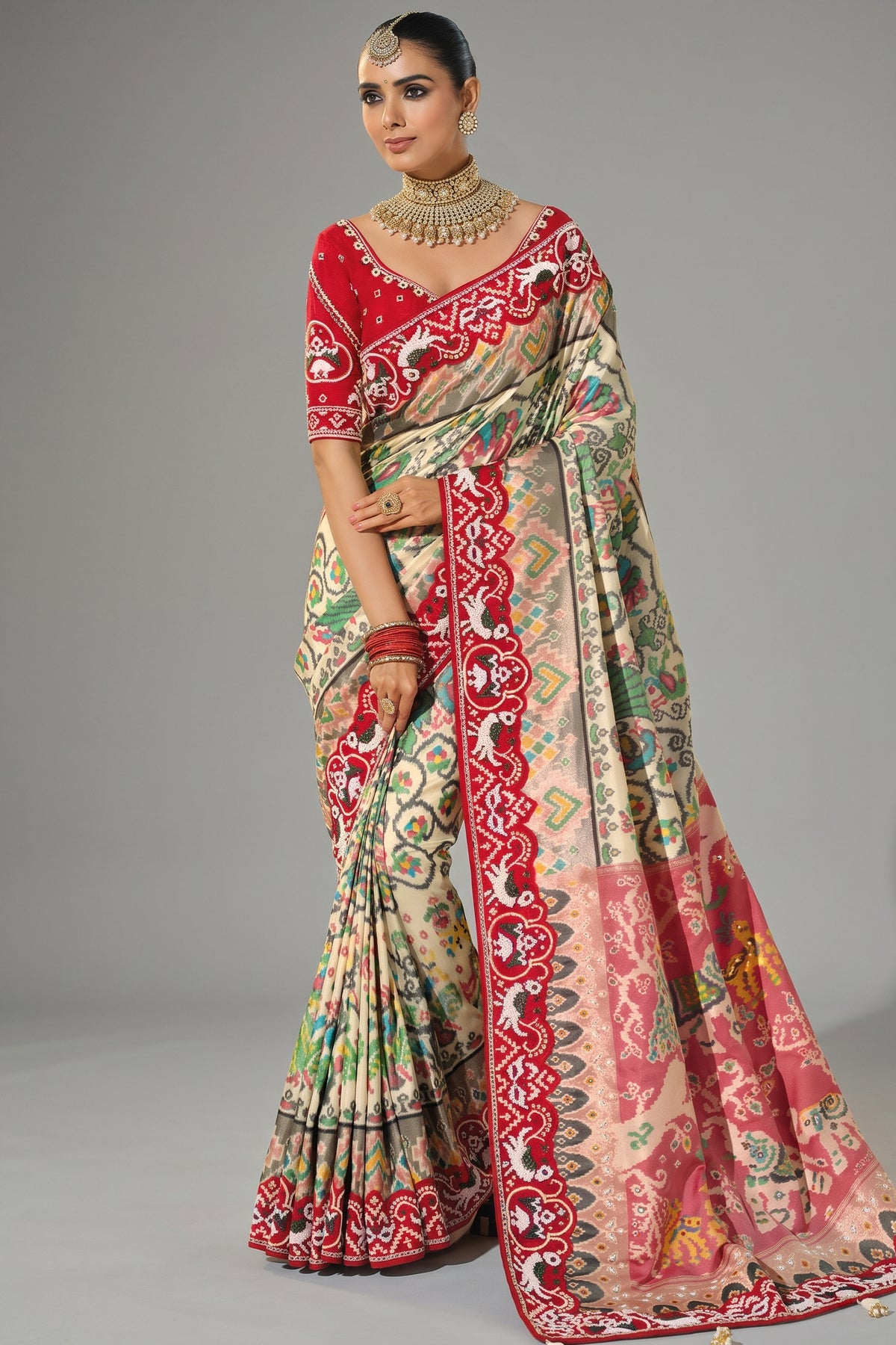 Cream Silk Traditional Patola Saree with Contrast Beaded Border
