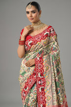 Cream Silk Traditional Patola Saree with Contrast Beaded Border