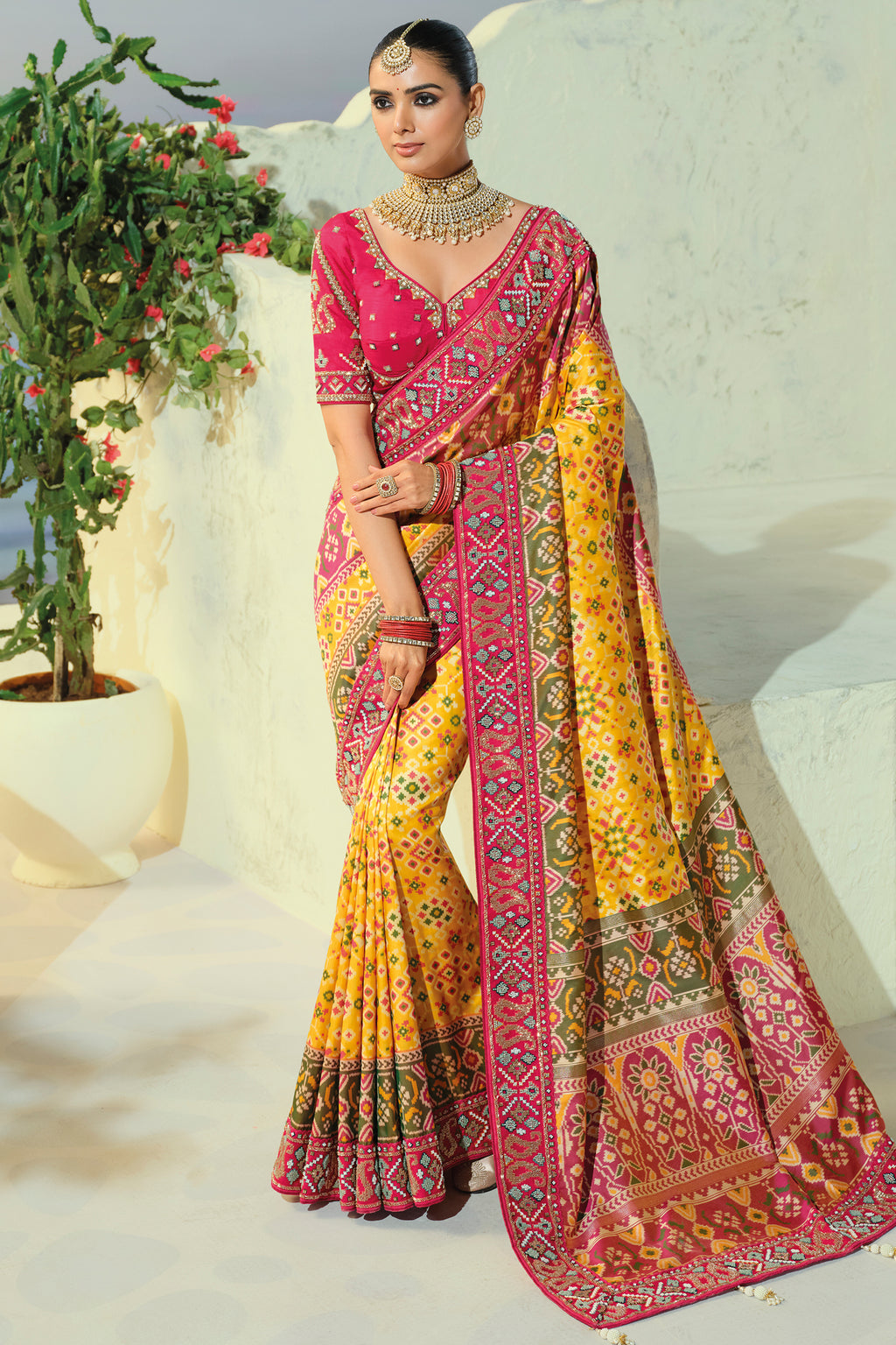 Yellow Silk Woven Patola Traditional Saree with Contrast Beaded Border