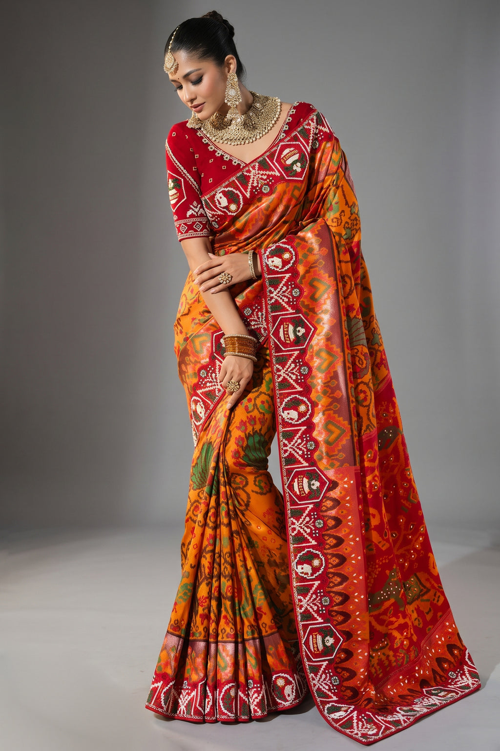 Orange Silk Traditional Woven Patola Saree with Contrast Beaded Work Border