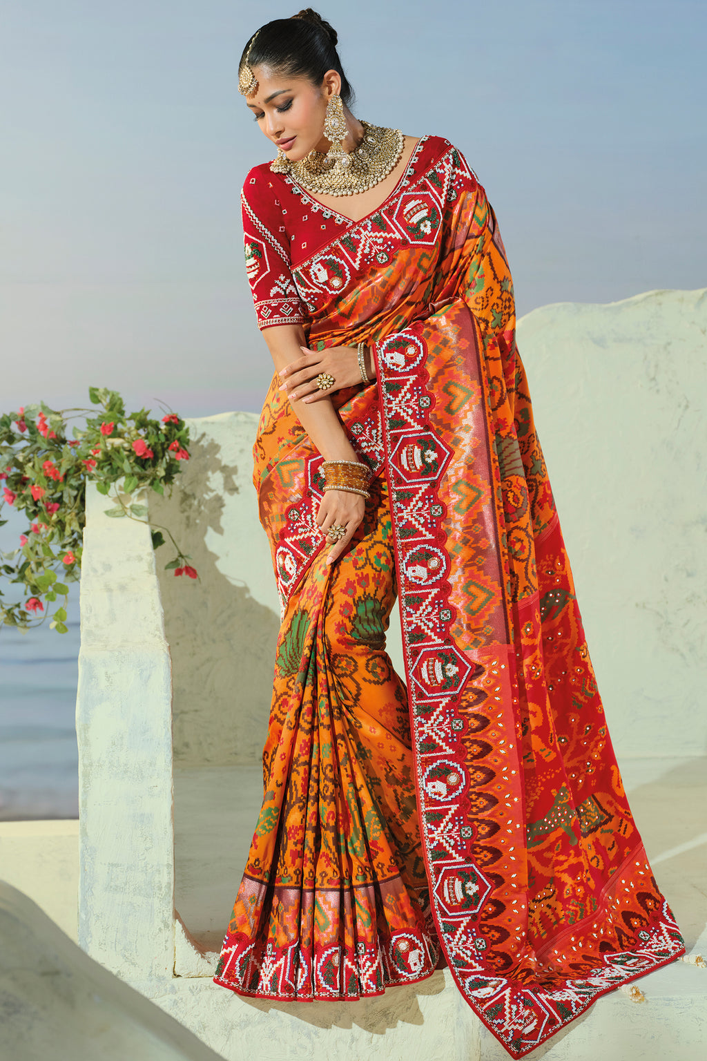 Orange Silk Traditional Woven Patola Saree with Contrast Beaded Work Border