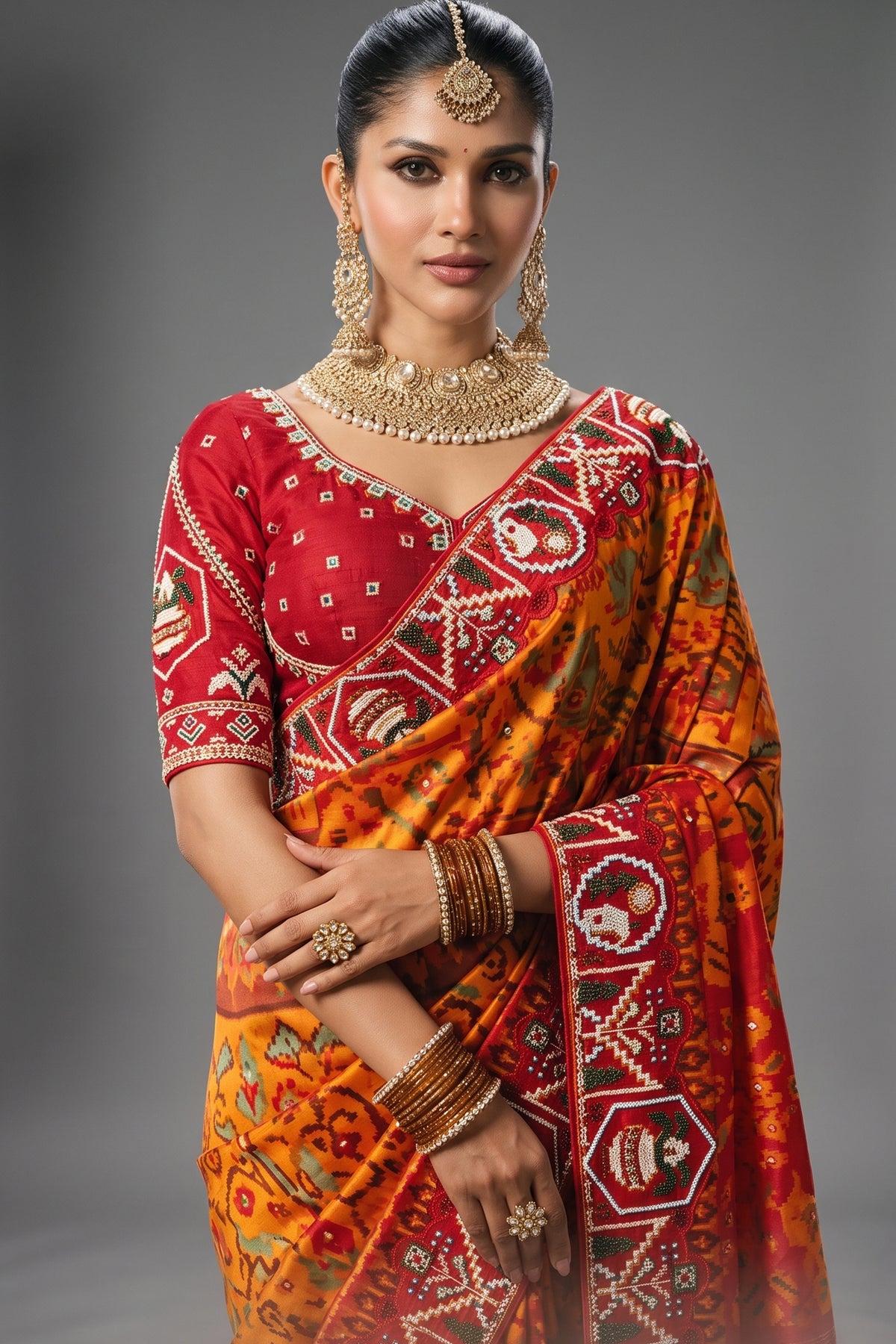 Orange Silk Traditional Woven Patola Saree with Contrast Beaded Work Border