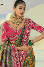 Mustard Silk Traditional Woven Patola Saree with Contrast Beaded Border and Pallu