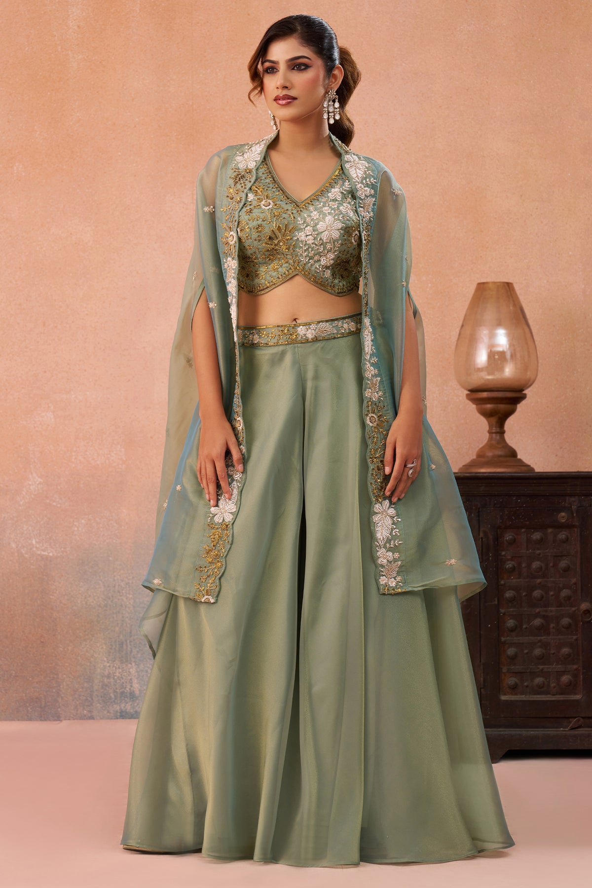 Model wearing Sage Green Tissue Beads Embroidered Crop Top with Flared Cape and Palazzo Set