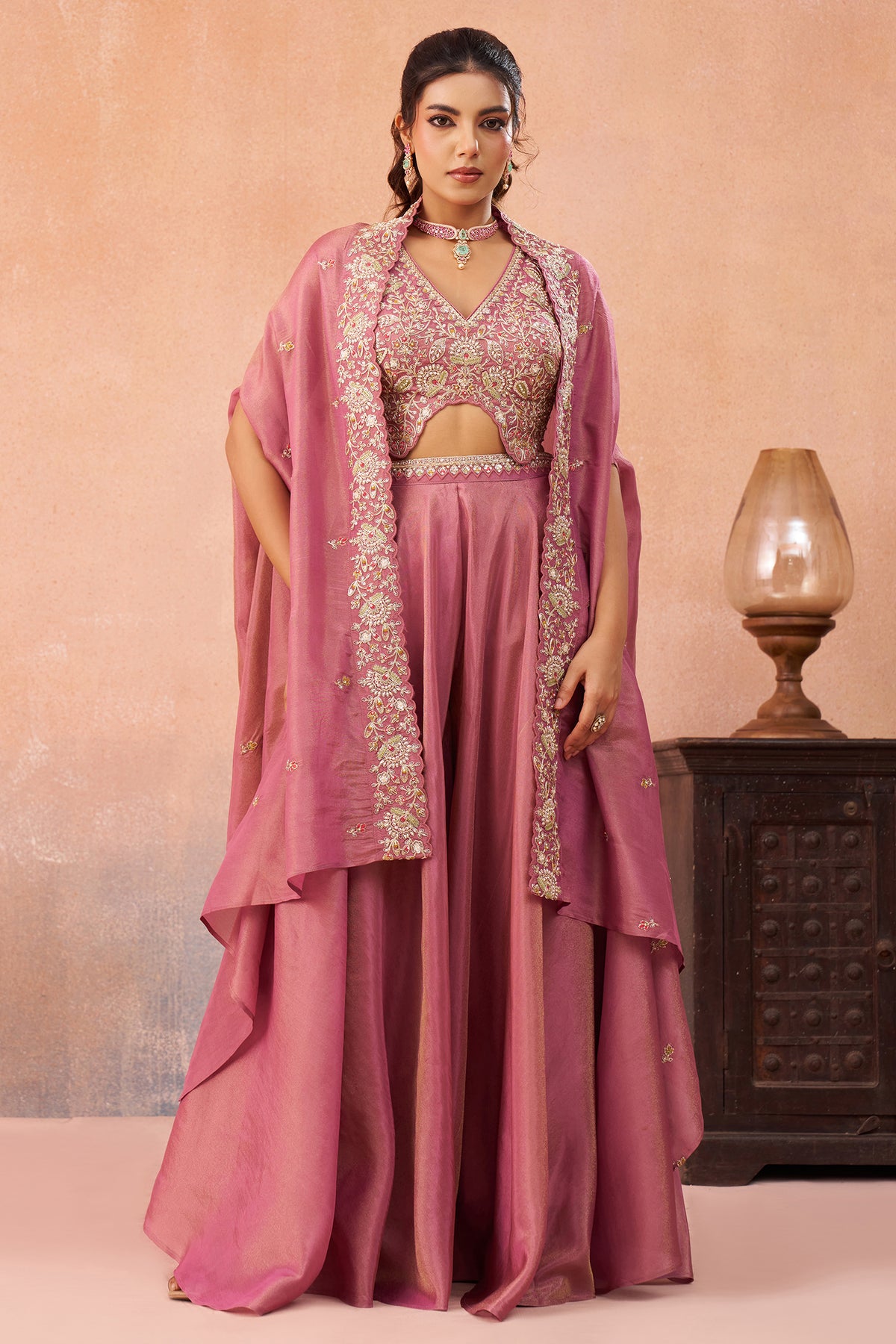Model wearing Coral Pink Crepe Beads Embroidered Crop Top with Cape and Flared Palazzo Set