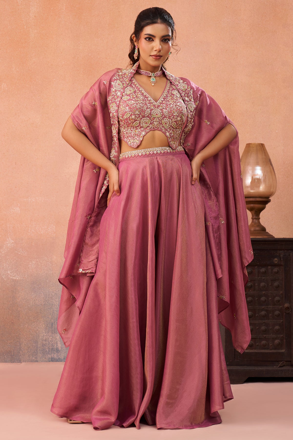 Back view of Coral Pink Crepe Beads Embroidered Crop Top with Cape and Flared Palazzo Set