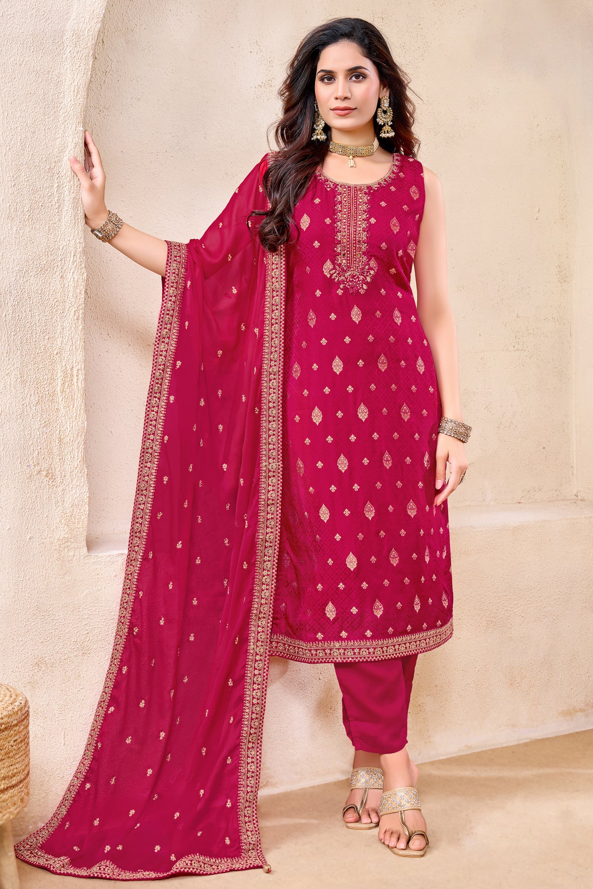 Model wearing Rani Pink Art Silk Woven Straight Cut Suit with Matching Dupatta