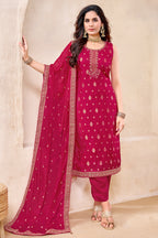 Model wearing Rani Pink Art Silk Woven Straight Cut Suit with Matching Dupatta