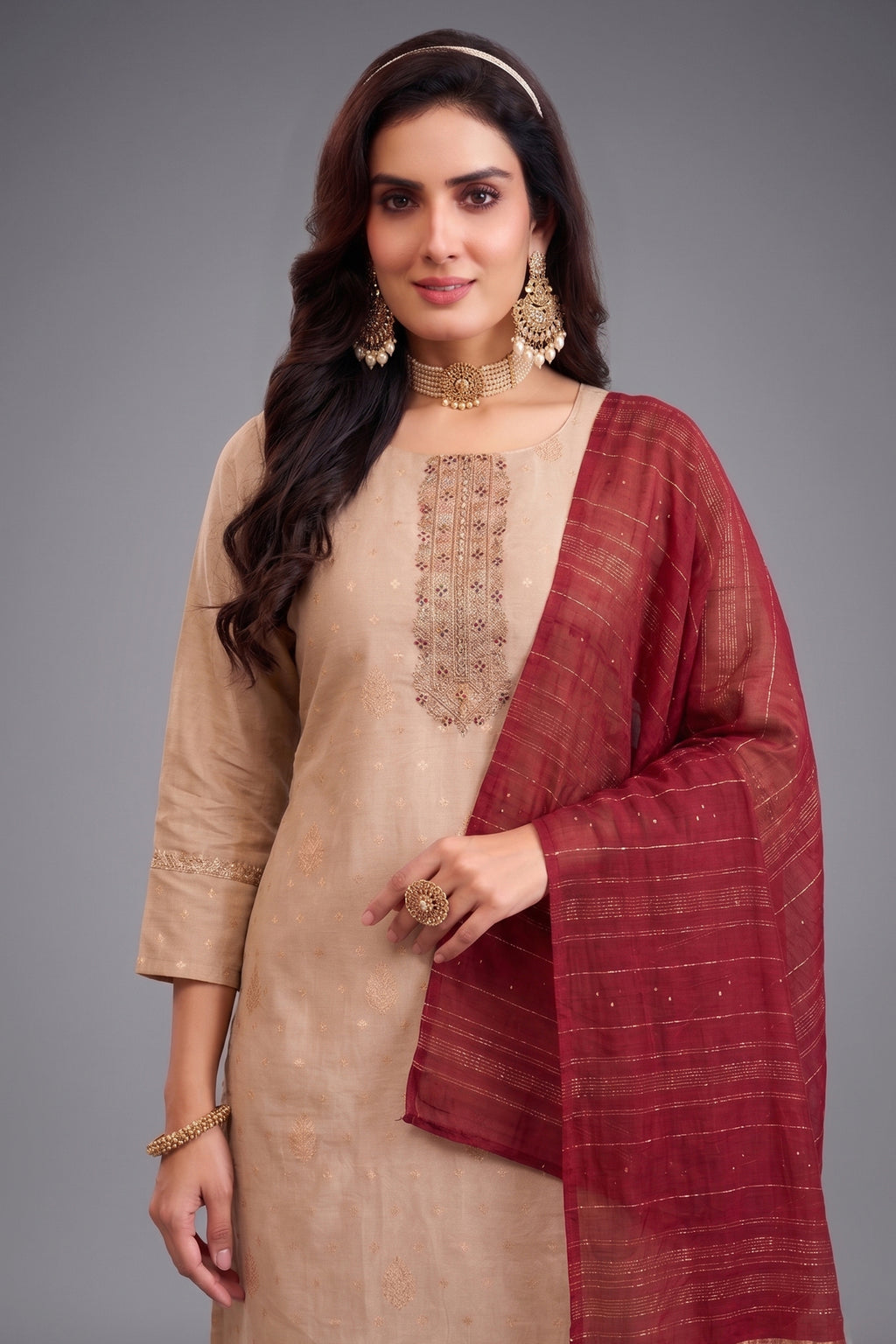 Close up of Pale Peach Tissue Woven Kurta and Contrasting Maroon Dupatta