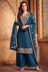 Model wearing traditional rama blue art silk embroidered palazzo suit