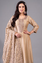 Close up of intricate embroidery work on cream art silk anarkali suit