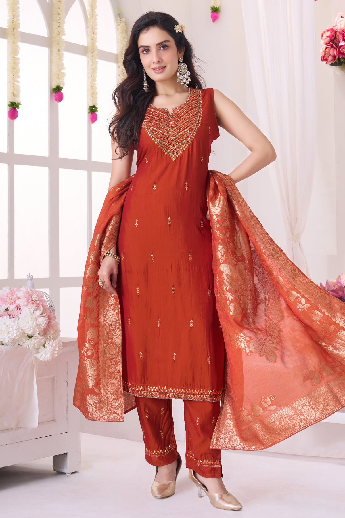 Model wearing rust orange mirror embroidered straight cut traditional suit
