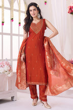 Model wearing rust orange mirror embroidered straight cut traditional suit