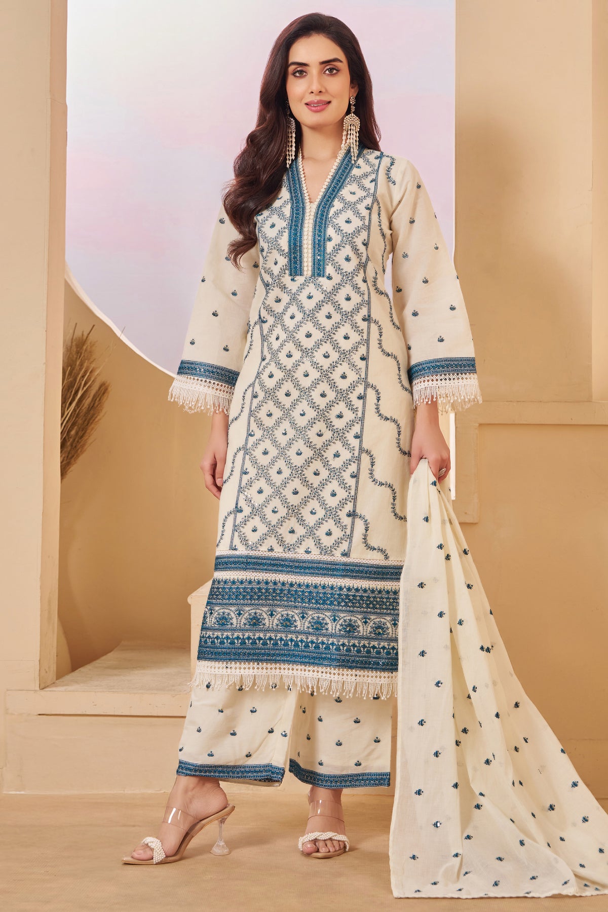 Elegant styling of Off White Cotton Embroidered Straight Cut Suit
