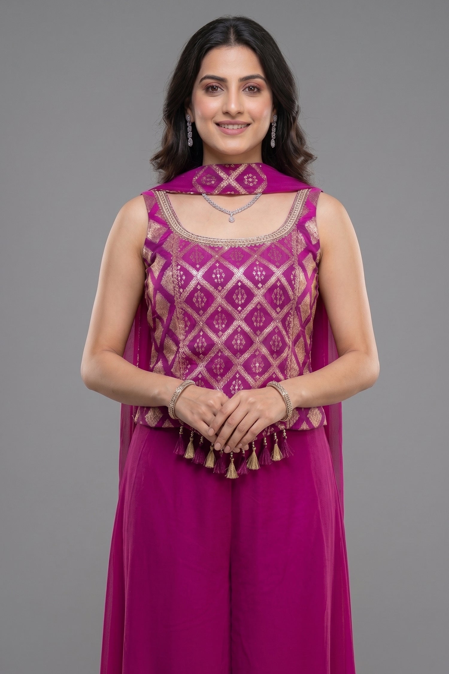 Model showcasing Pink Georgette Woven Palazzo Set with intricate designs and elegant styling.