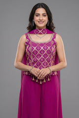 Model showcasing Pink Georgette Woven Palazzo Set with intricate designs and elegant styling.