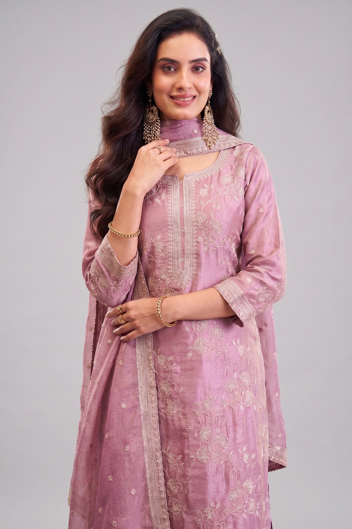 Close-up of intricate thread embroidery on Mauve Pink Tissue Silk Suit fabric