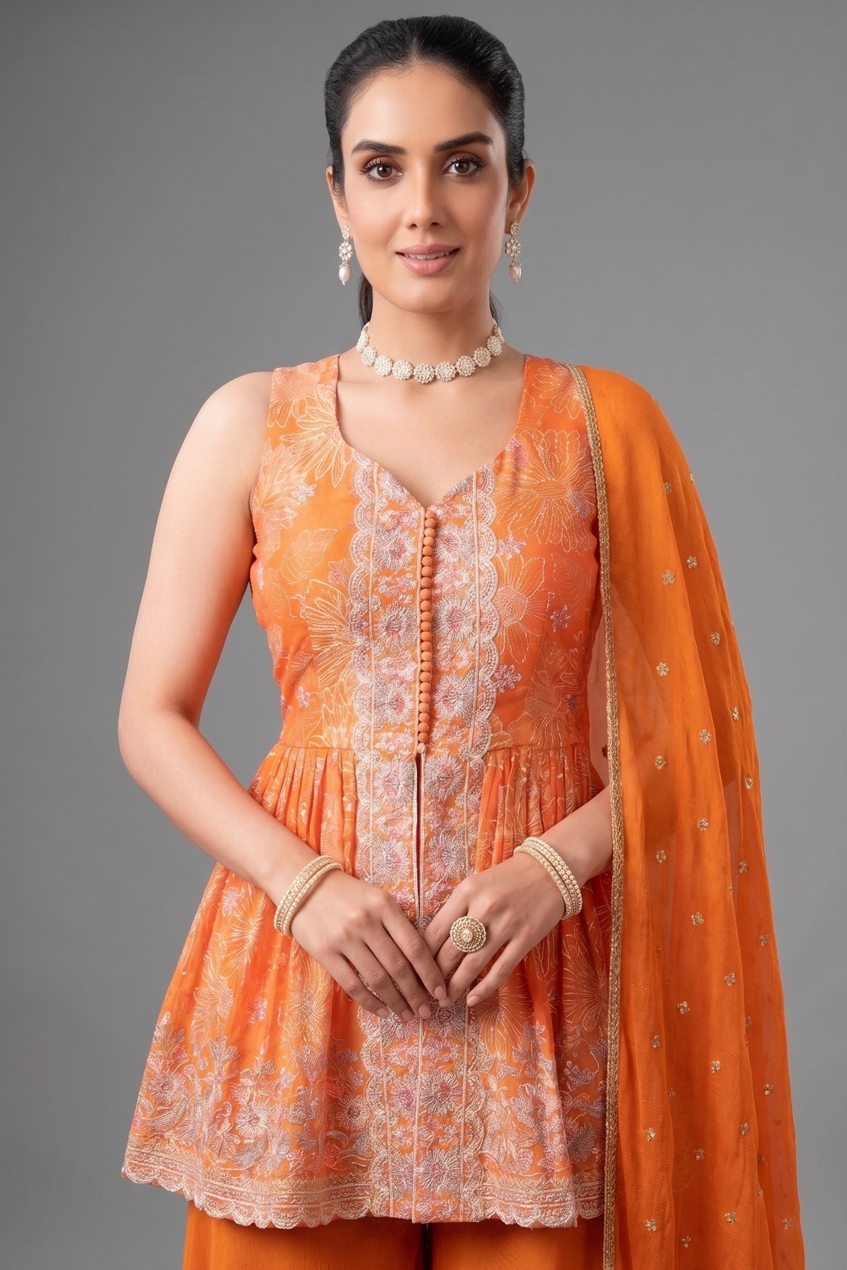 Close-up of floral prints and fabric on Orange Chinon Chiffon Peplum Palazzo Suit