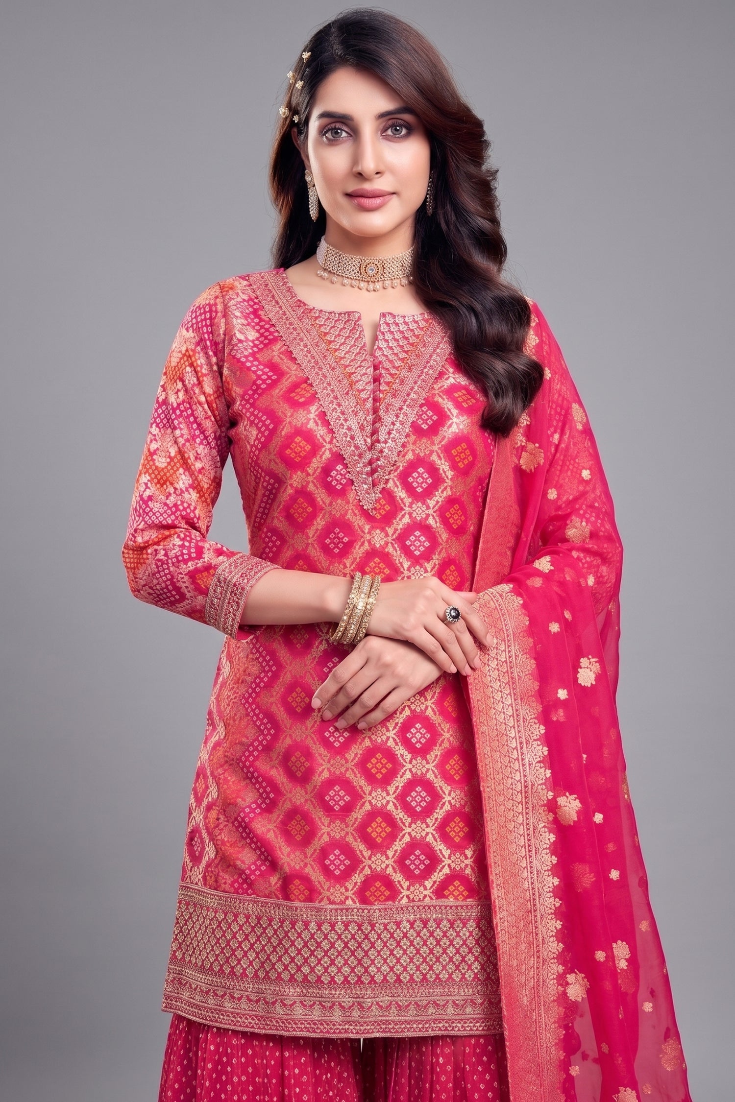 Close-up of Bandhej woven patterns and sequins on Light Pink Georgette Suit