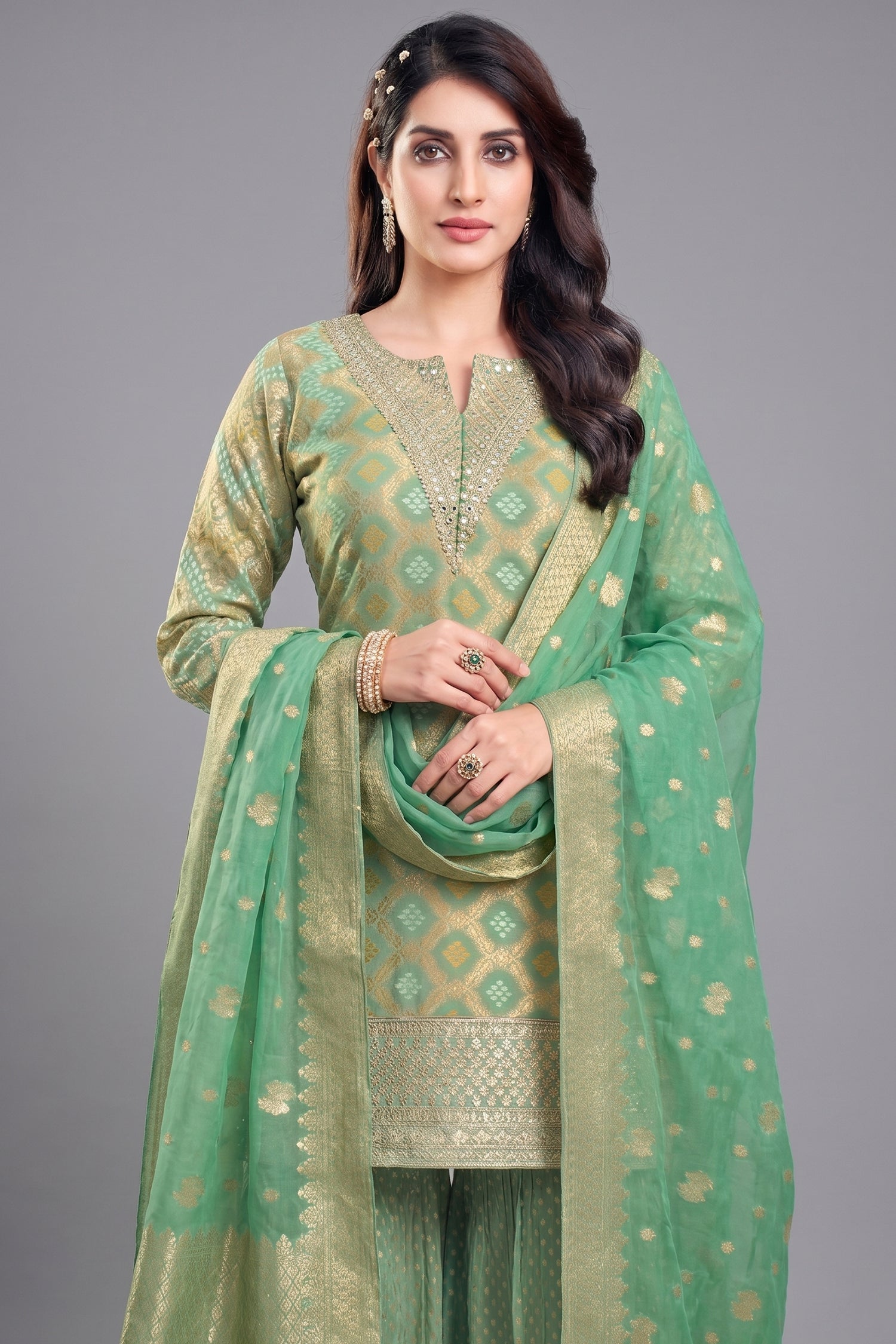 Close-up of Bandhej woven pattern and sequins on Green Georgette Sharara Suit