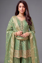 Close-up of the intricate weaving on Sea Green Tissue Silk Sharara Suit fabric
