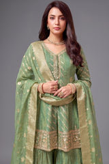 Close-up of the intricate weaving on Sea Green Tissue Silk Sharara Suit fabric