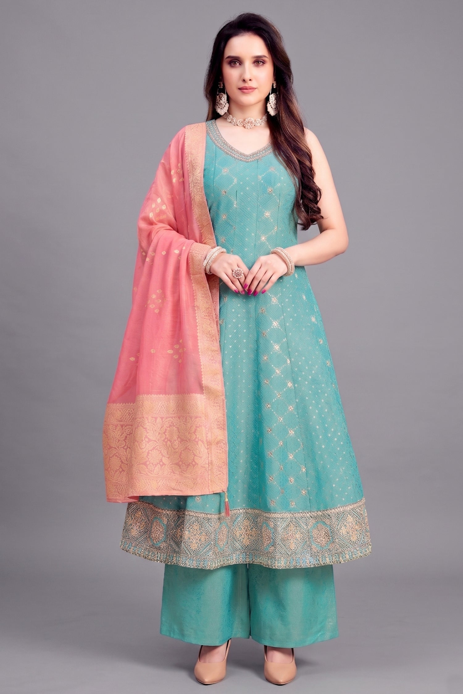 Light sky blue tissue woven anarkali suit with elegant sequin embroidery.