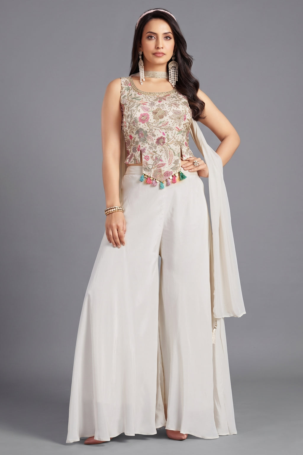Off white crepe silk crop top and palazzo set with vibrant floral prints.