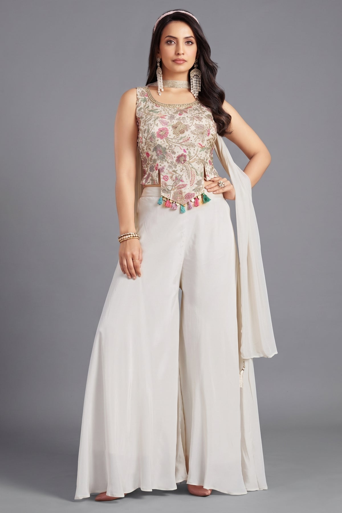 Off white crepe silk crop top and palazzo set with vibrant floral prints.