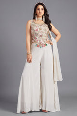 Off white crepe silk crop top and palazzo set with vibrant floral prints.