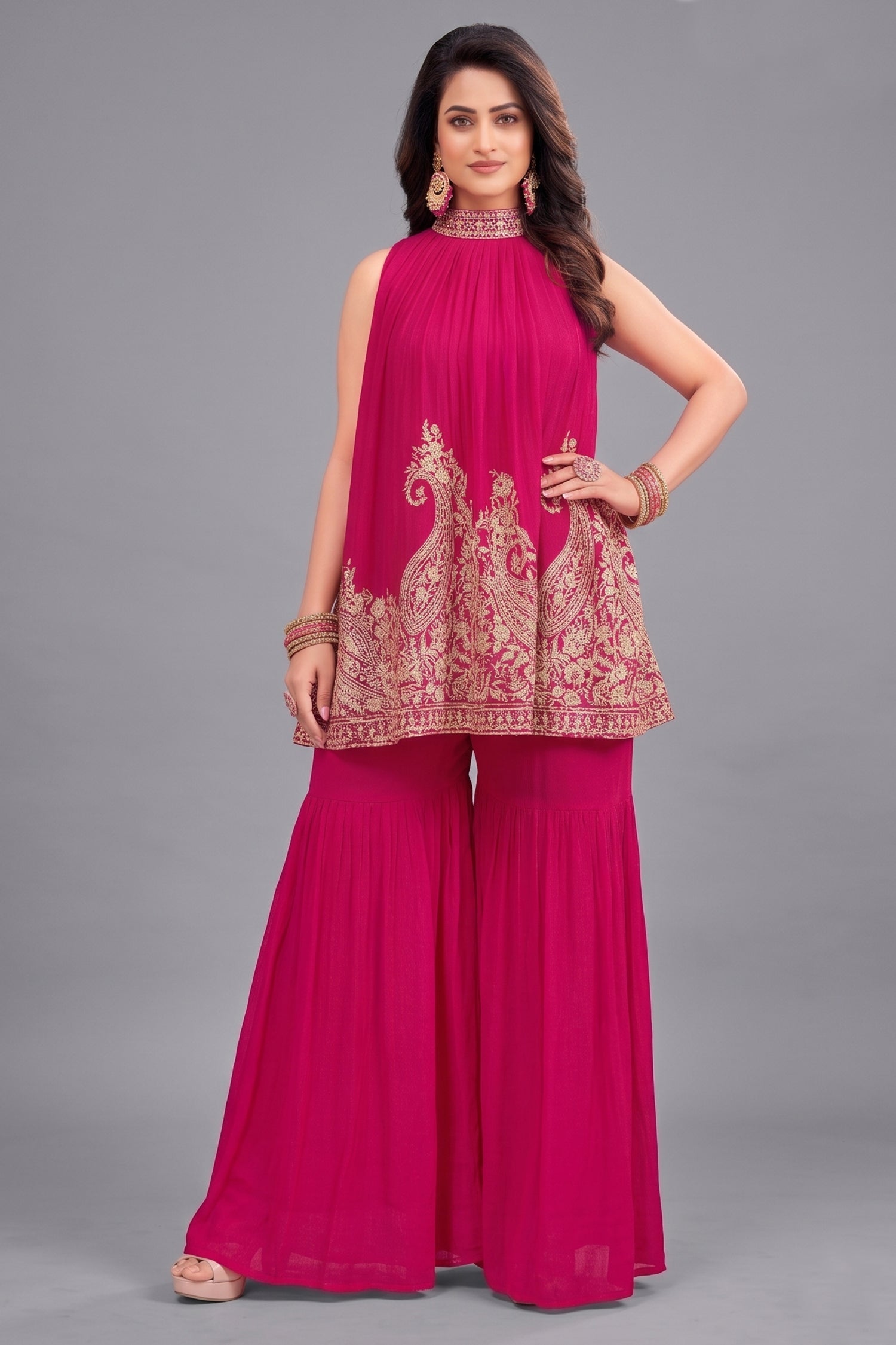 Dark pink georgette high neck sharara set with intricate sequin embroidery.
