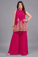 Dark pink georgette high neck sharara set with intricate sequin embroidery.
