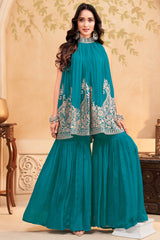 Turquoise blue georgette high neck sharara set with intricate sequin embroidery.