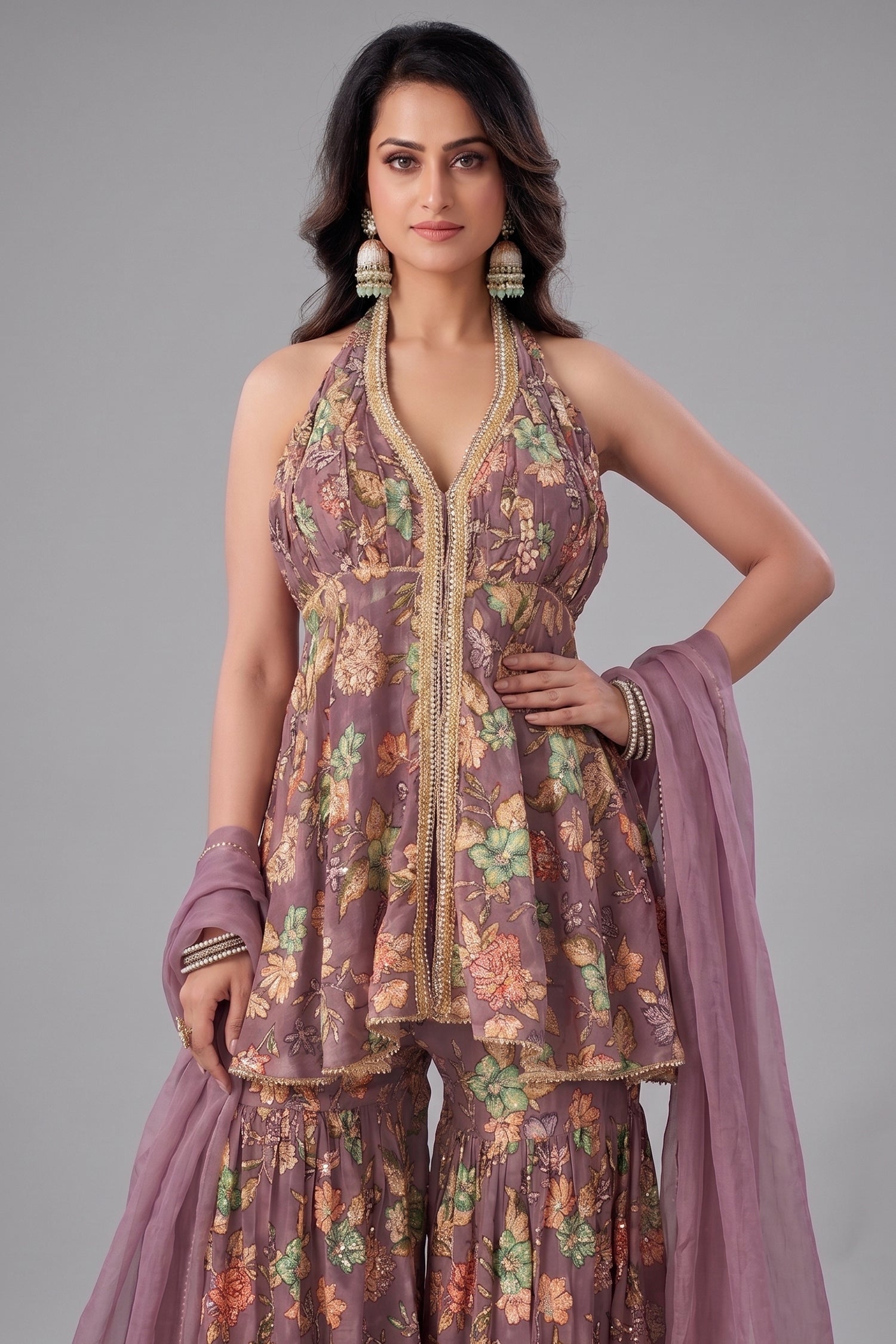 Close-up of the floral print and sequin detailing on the onion pink tissue fabric.