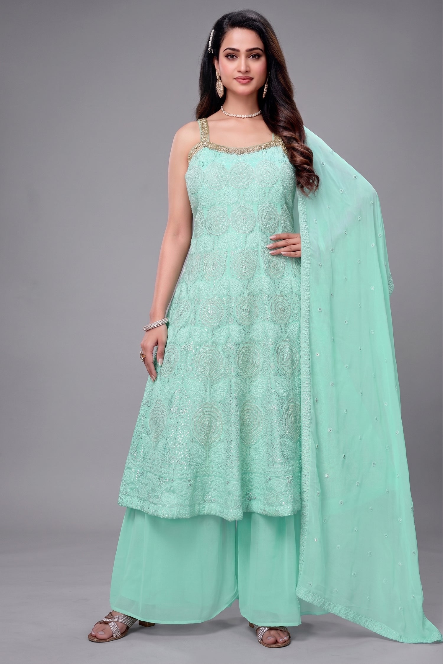 Firozi georgette anarkali suit with heavy floral embroidery and sequin work.
