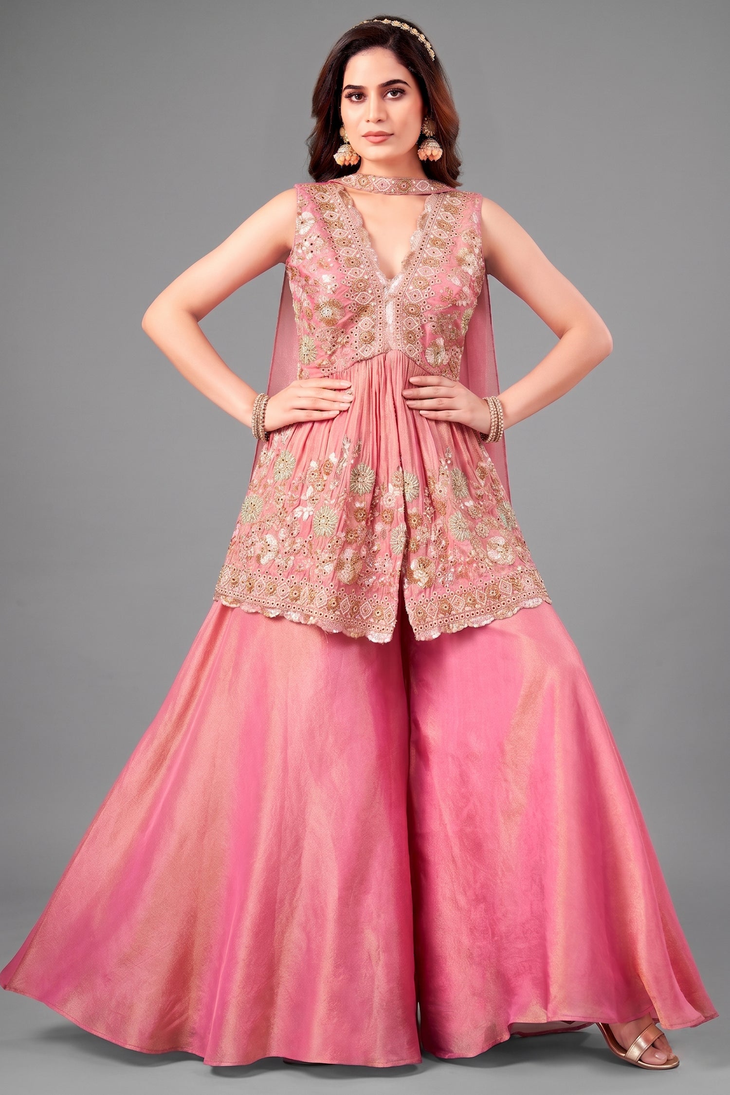 Front view of Pink Tissue Silk Peplum suit with heavy beads and cutdana handwork.