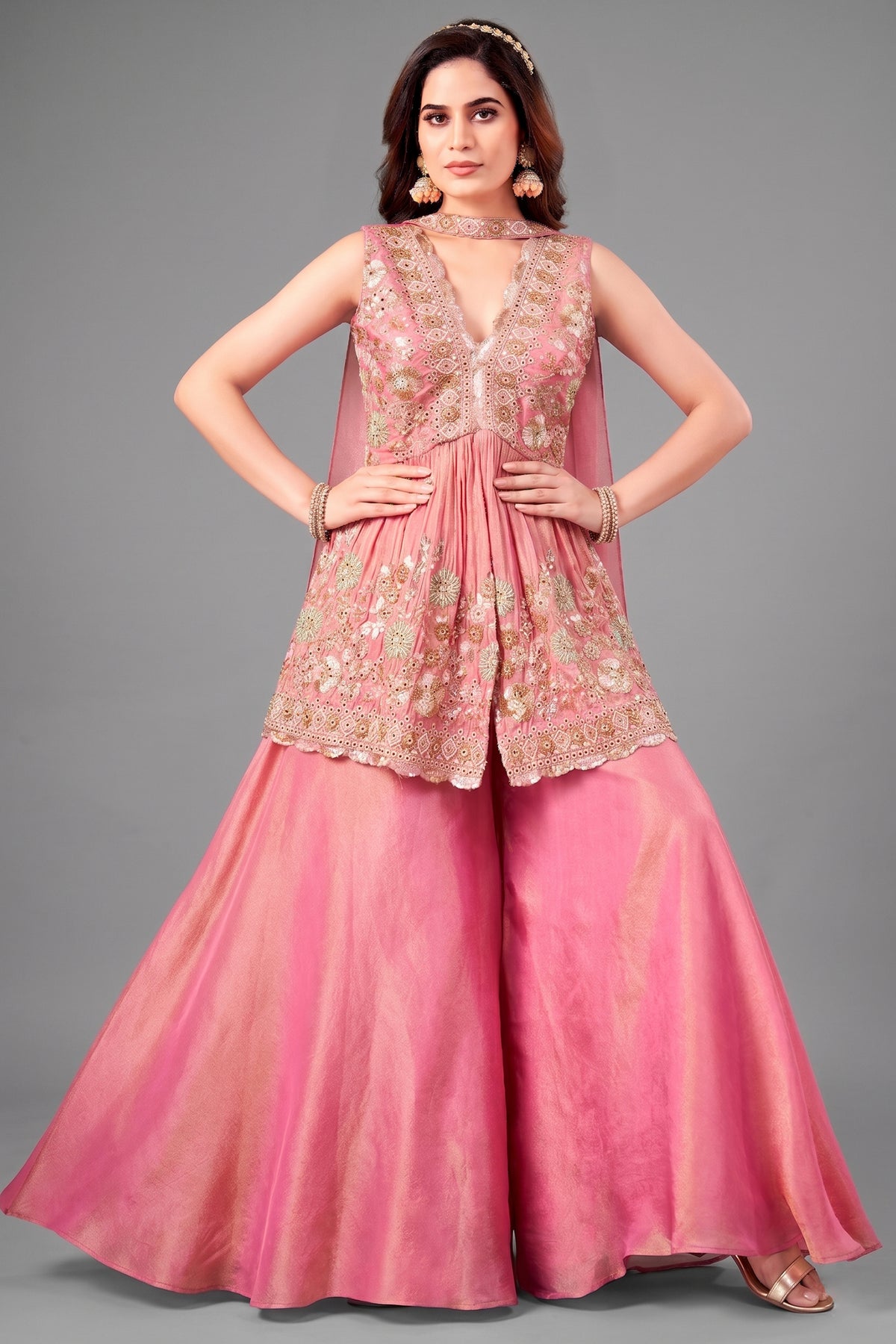Front view of Pink Tissue Silk Peplum suit with heavy beads and cutdana handwork.